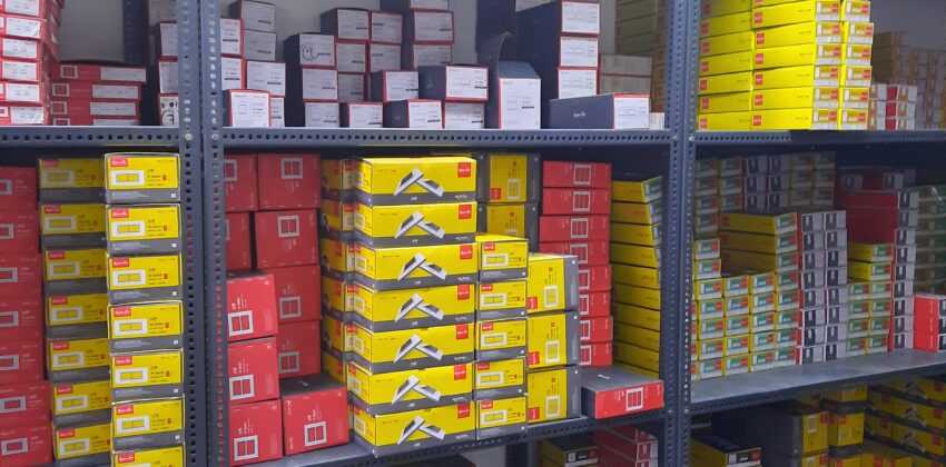 "GKSP Racking", Slotted angle rack Manufacturer in Bahadurgarh - Manufacturing slotted angle racks with GI panels from a decade. This rack has 7 feet height and is in dark grey color and have stored many types of boxes with electrical items/materials inside.