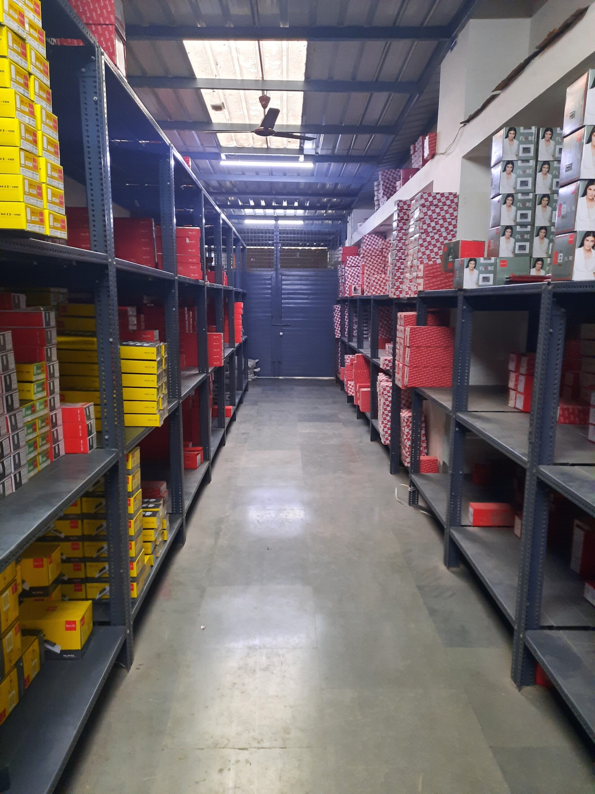 "GKSP Racking", Slotted angle rack Manufacturer in Bahadurgarh - Manufacturing slotted angle racks with GI panels from a decade. This rack has 7 feet height and is in dark grey color and have stored many types of boxes with electrical items/materials inside.